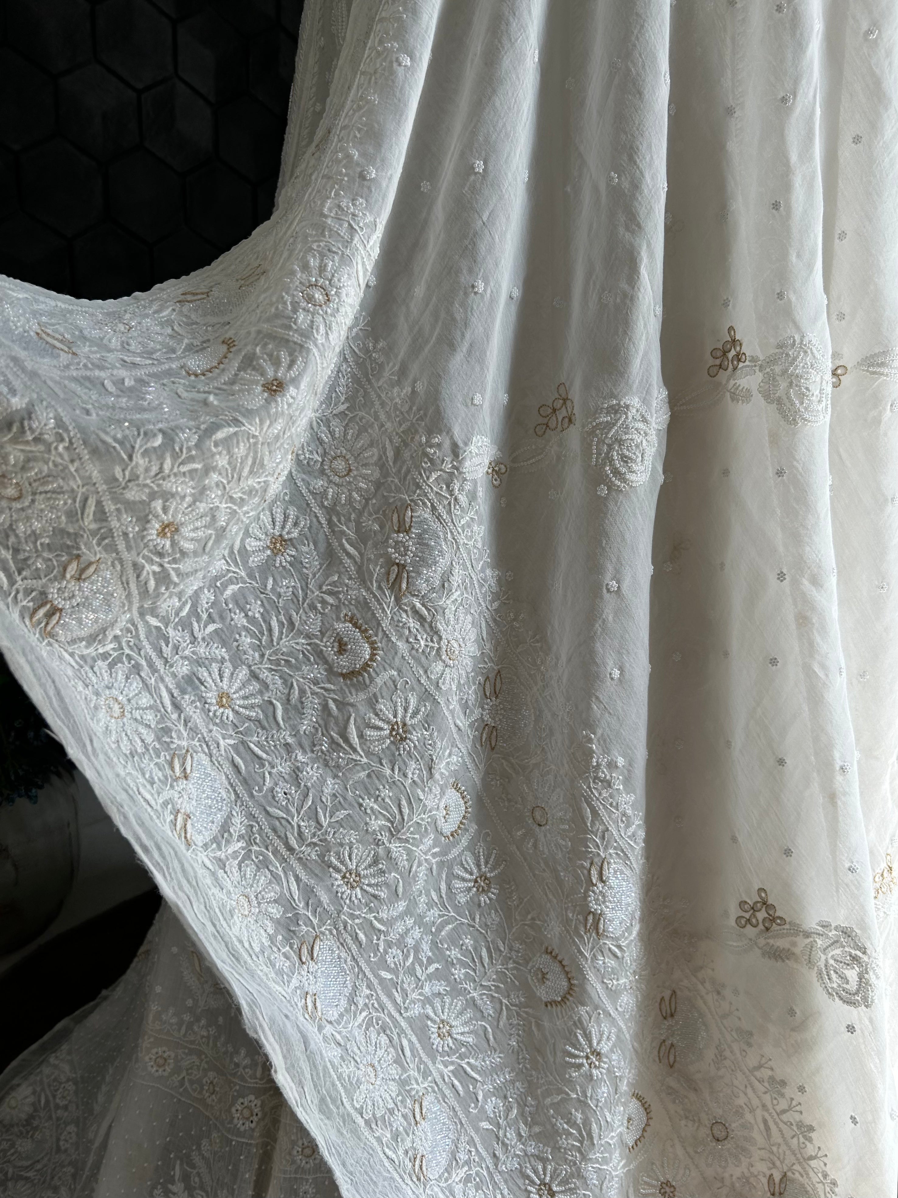 Premium white mul chanderi chikankari lehenga with statement pearl and kasab work