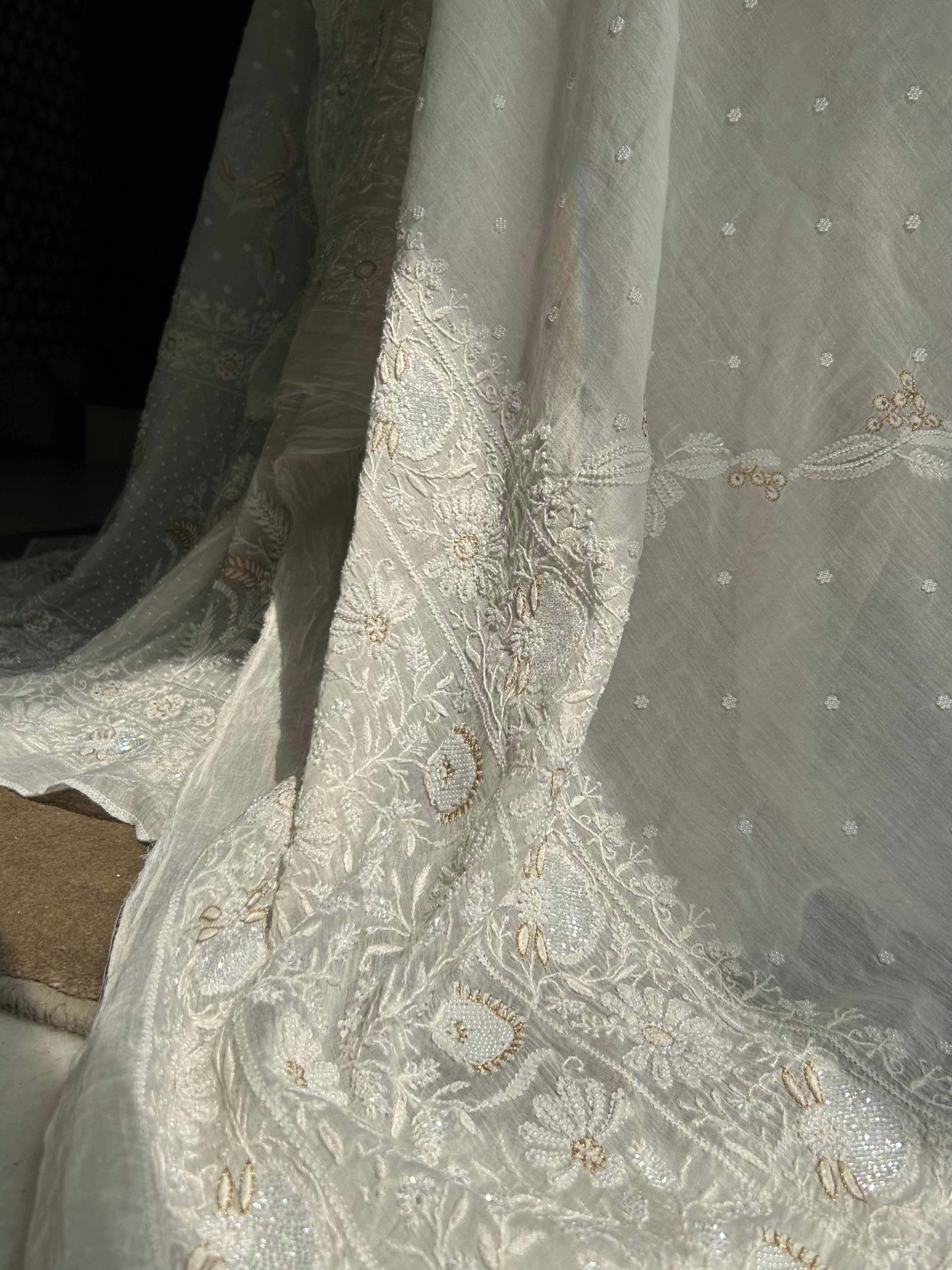 Premium white mul chanderi chikankari lehenga with statement pearl and kasab work