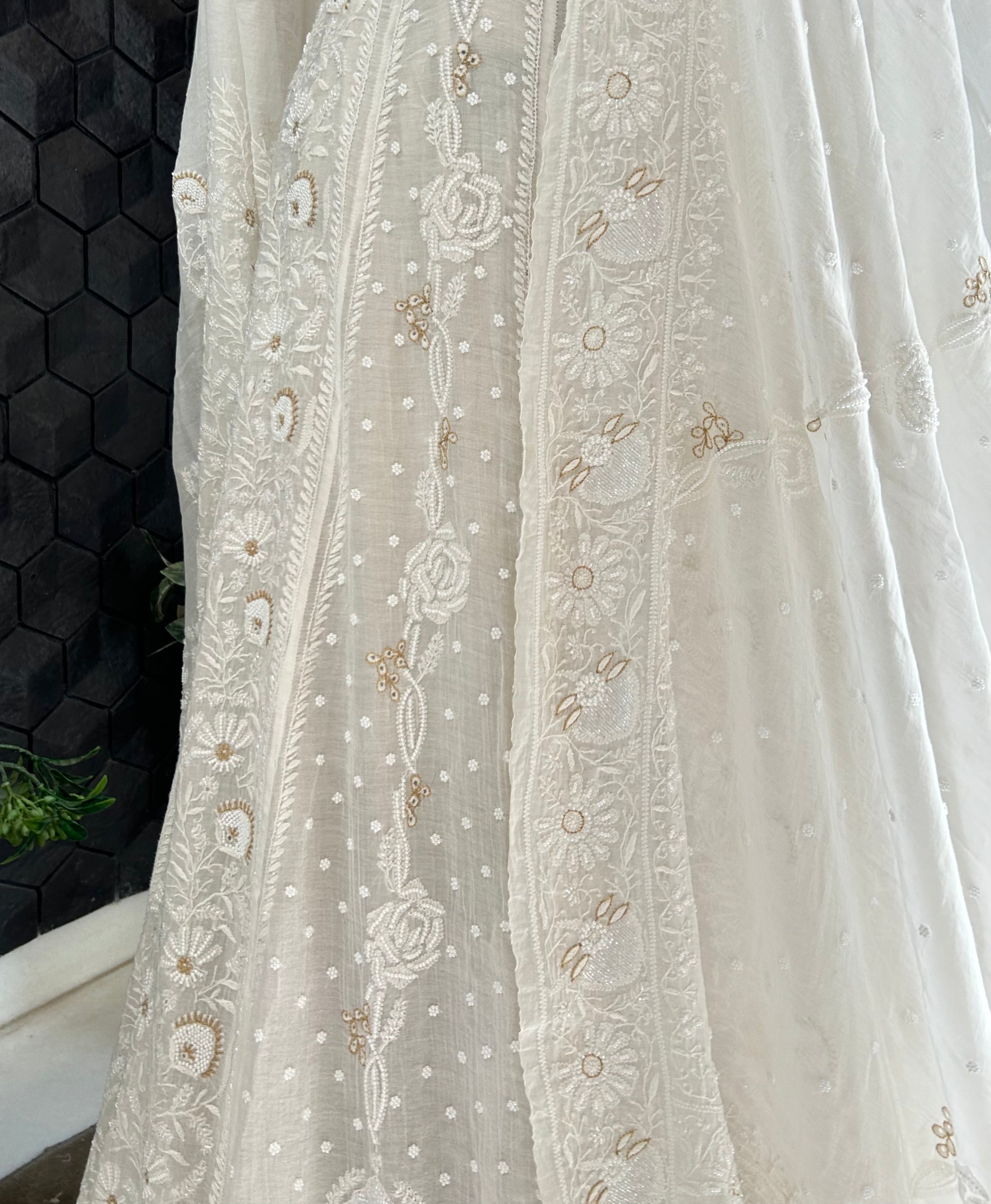 Premium white mul chanderi chikankari lehenga with statement pearl and kasab work