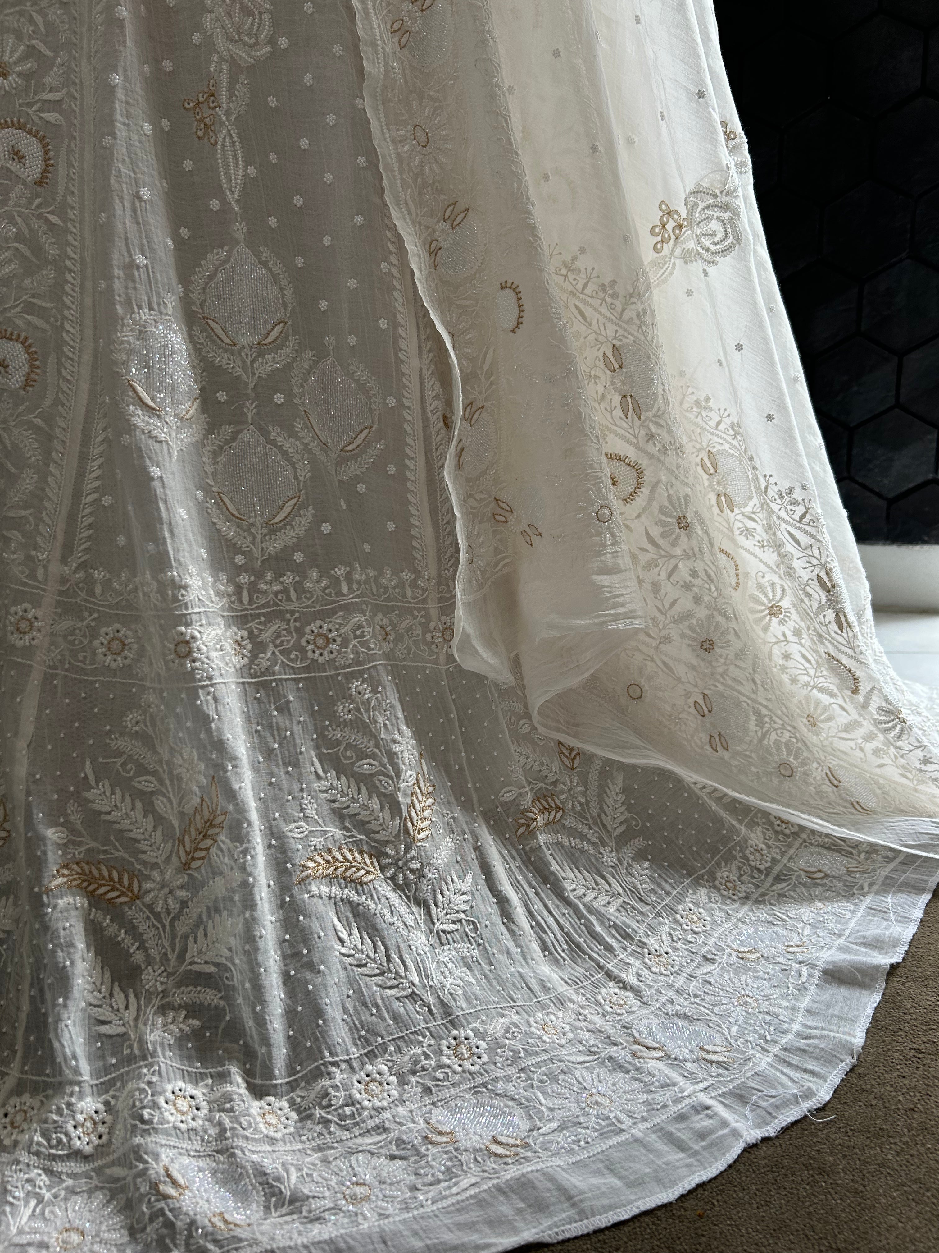 Premium white mul chanderi chikankari lehenga with statement pearl and kasab work