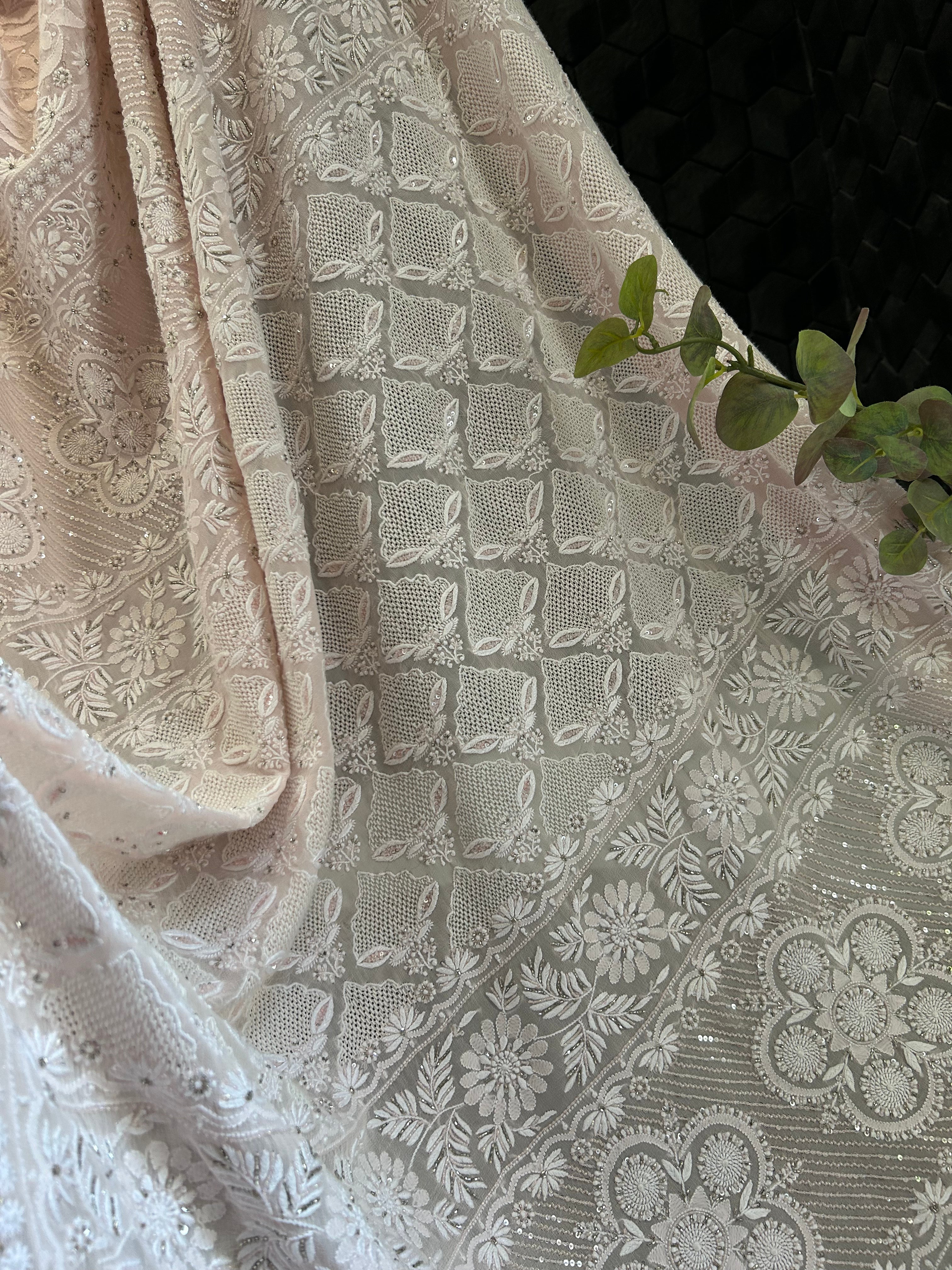 Premium Pink Georgette chikankari saree with statement heavy jaal
