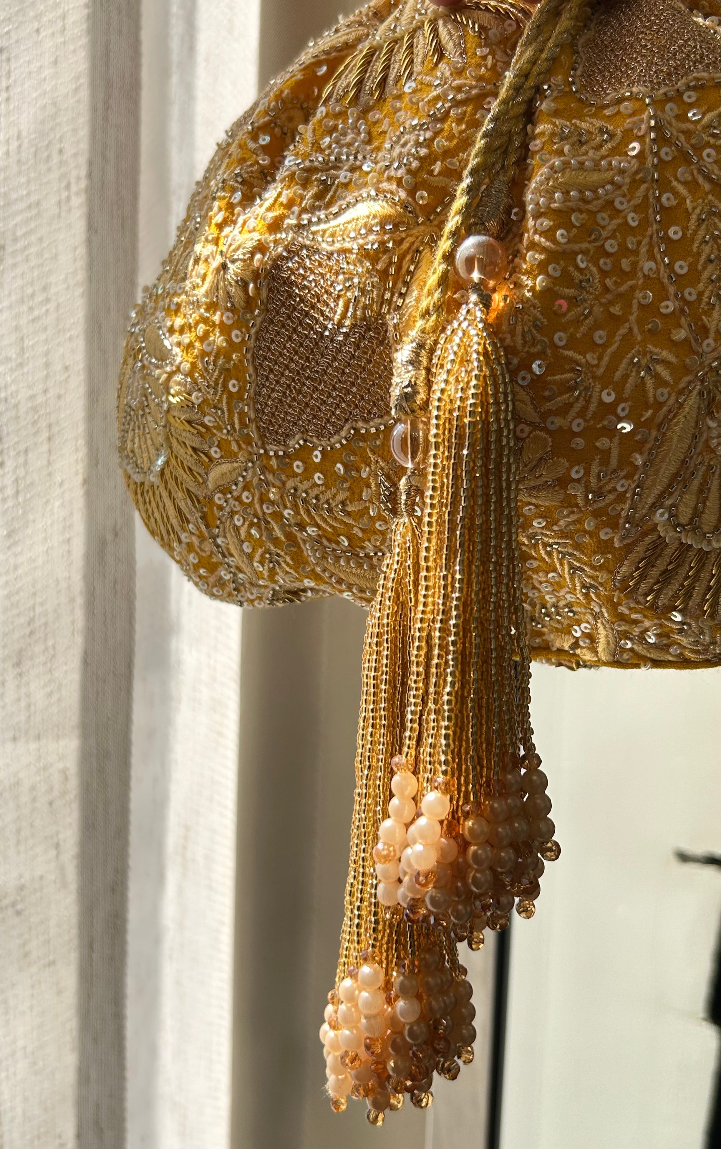 Yellow embellished chikankari potli bag