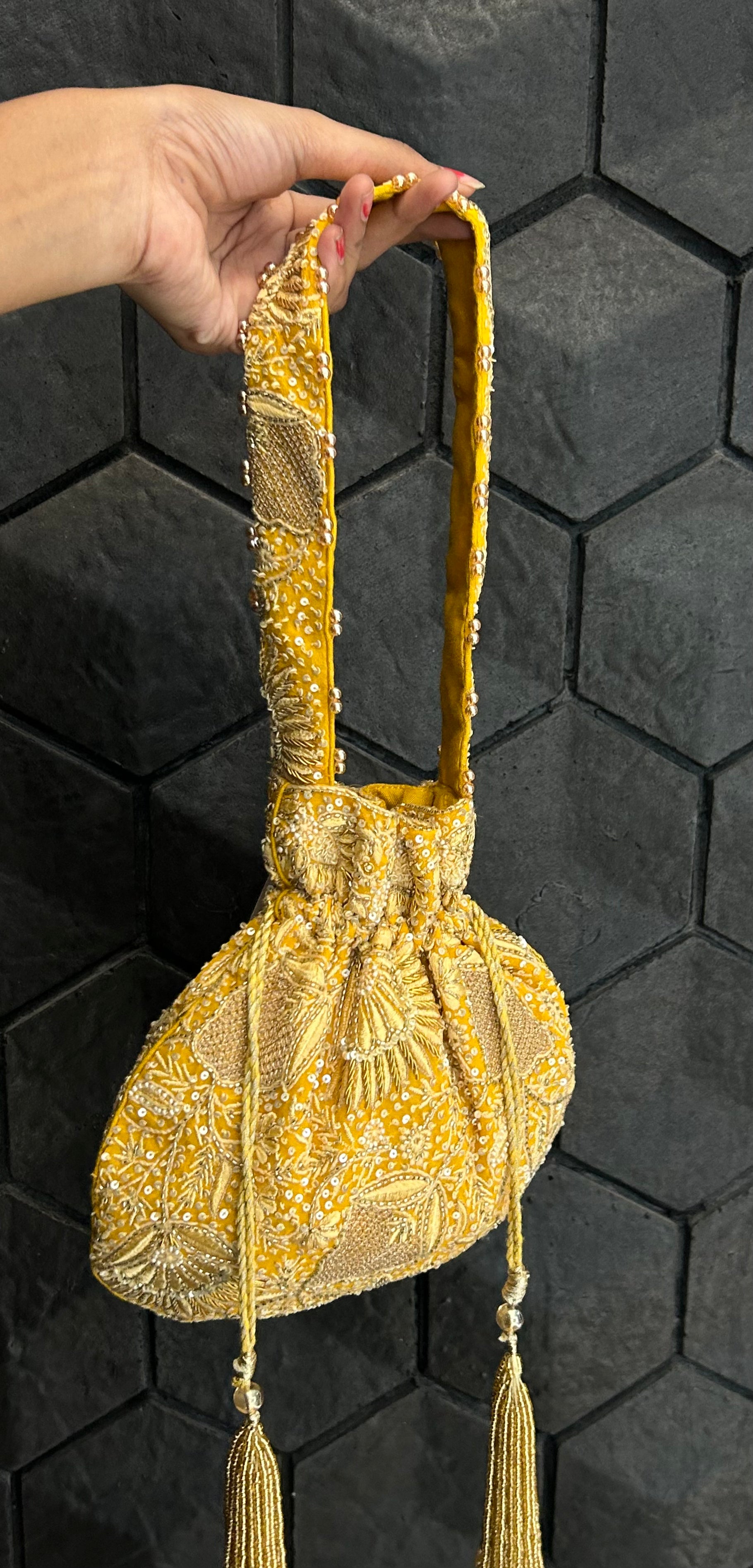 Yellow embellished chikankari potli bag