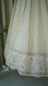 Ivory Chanderi Lehenga paired with embellished blouse