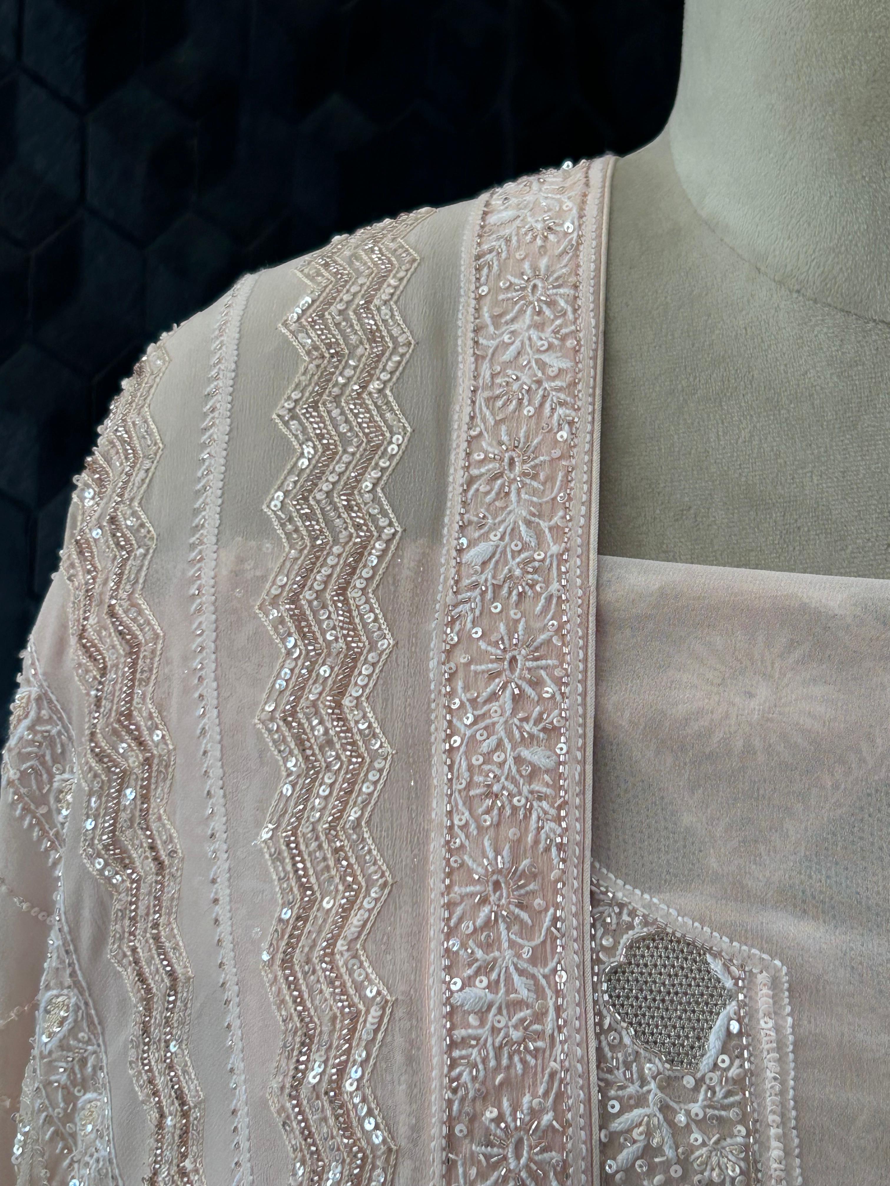 Peach georgette chikankari kurta set with statement jaal work