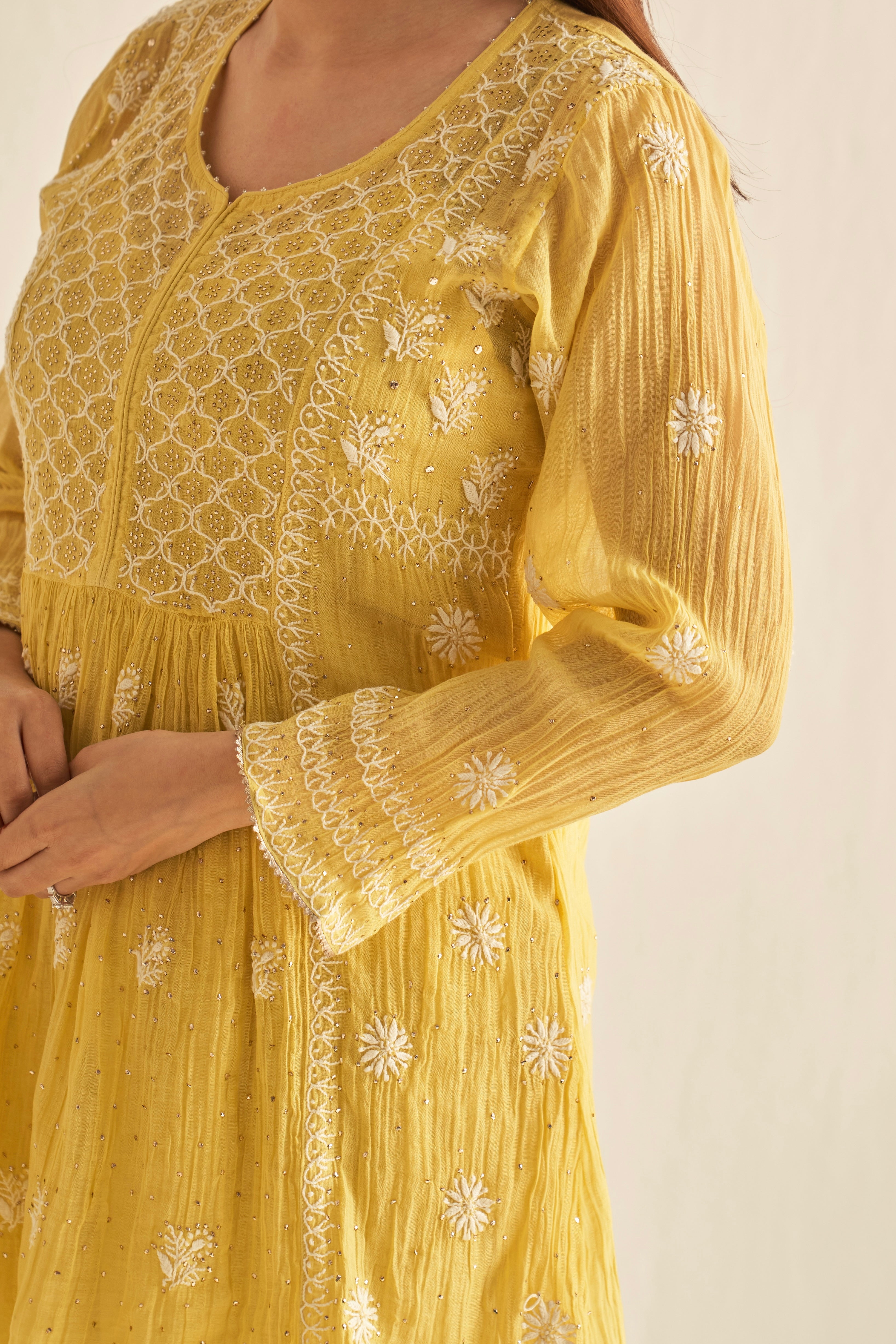 Yellow mul chanderi sharara set with mukaish and chikankari work
