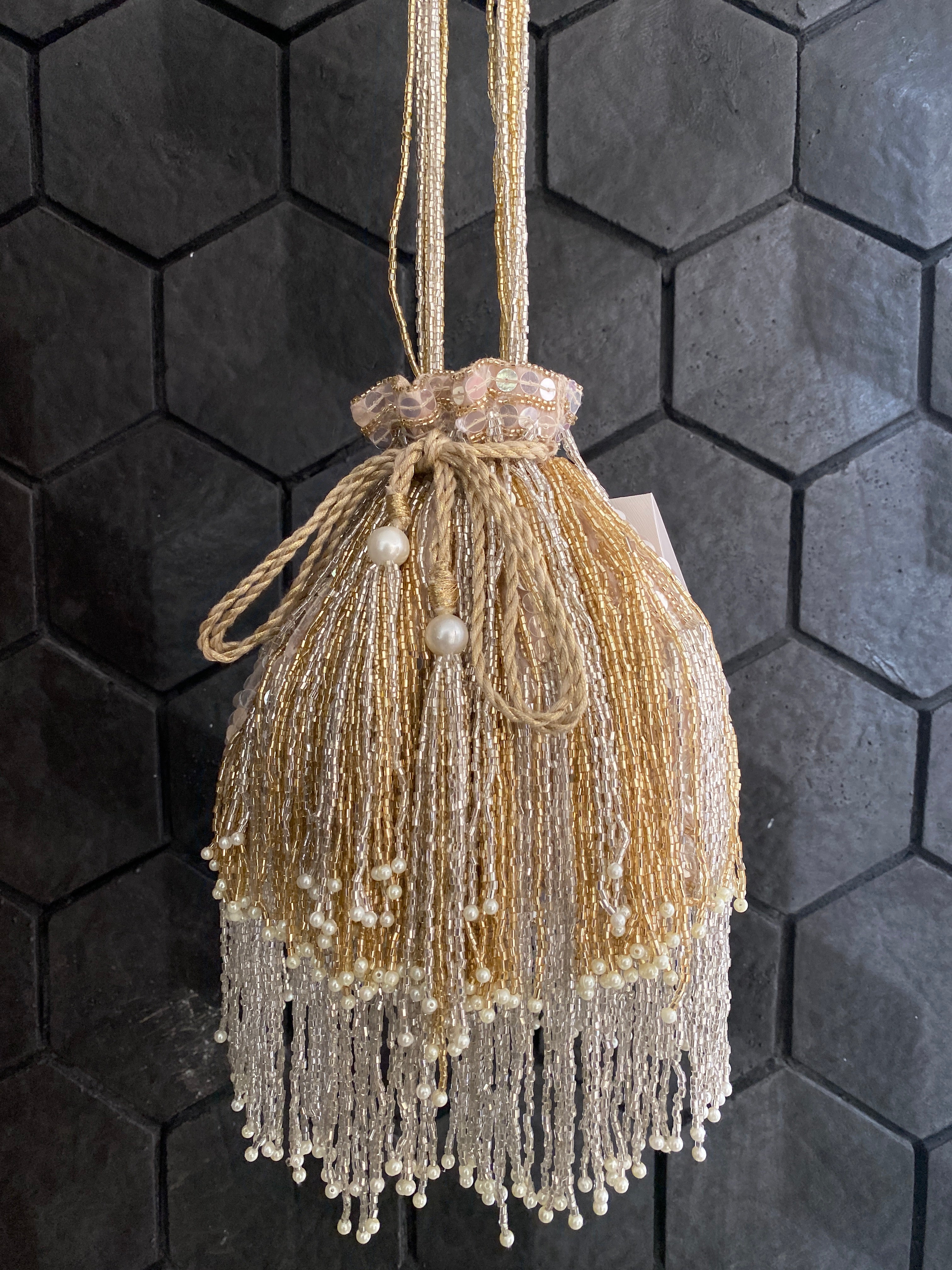 Gold and silver cutdana embellished potli bag