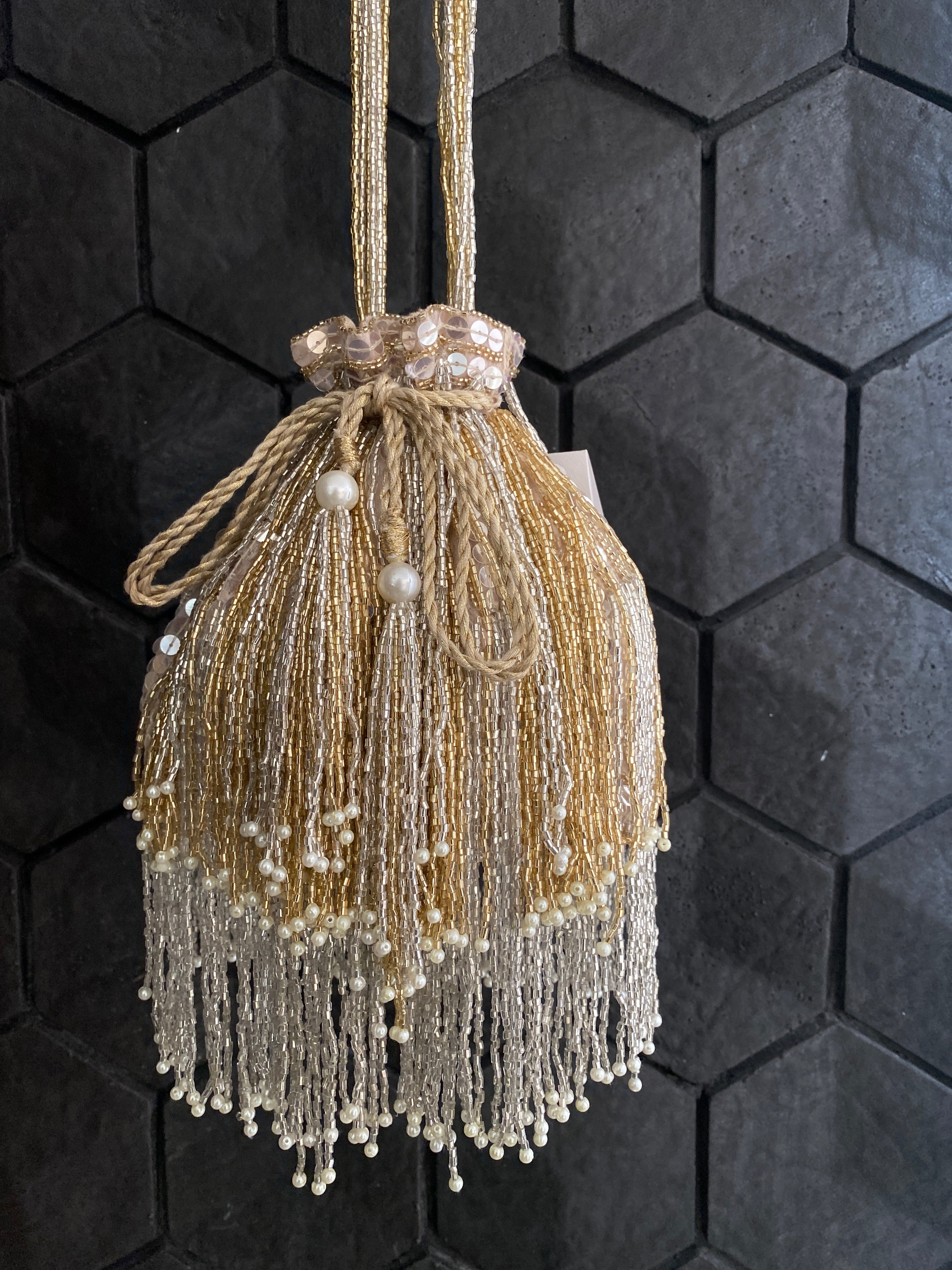 Gold and silver cutdana embellished potli bag