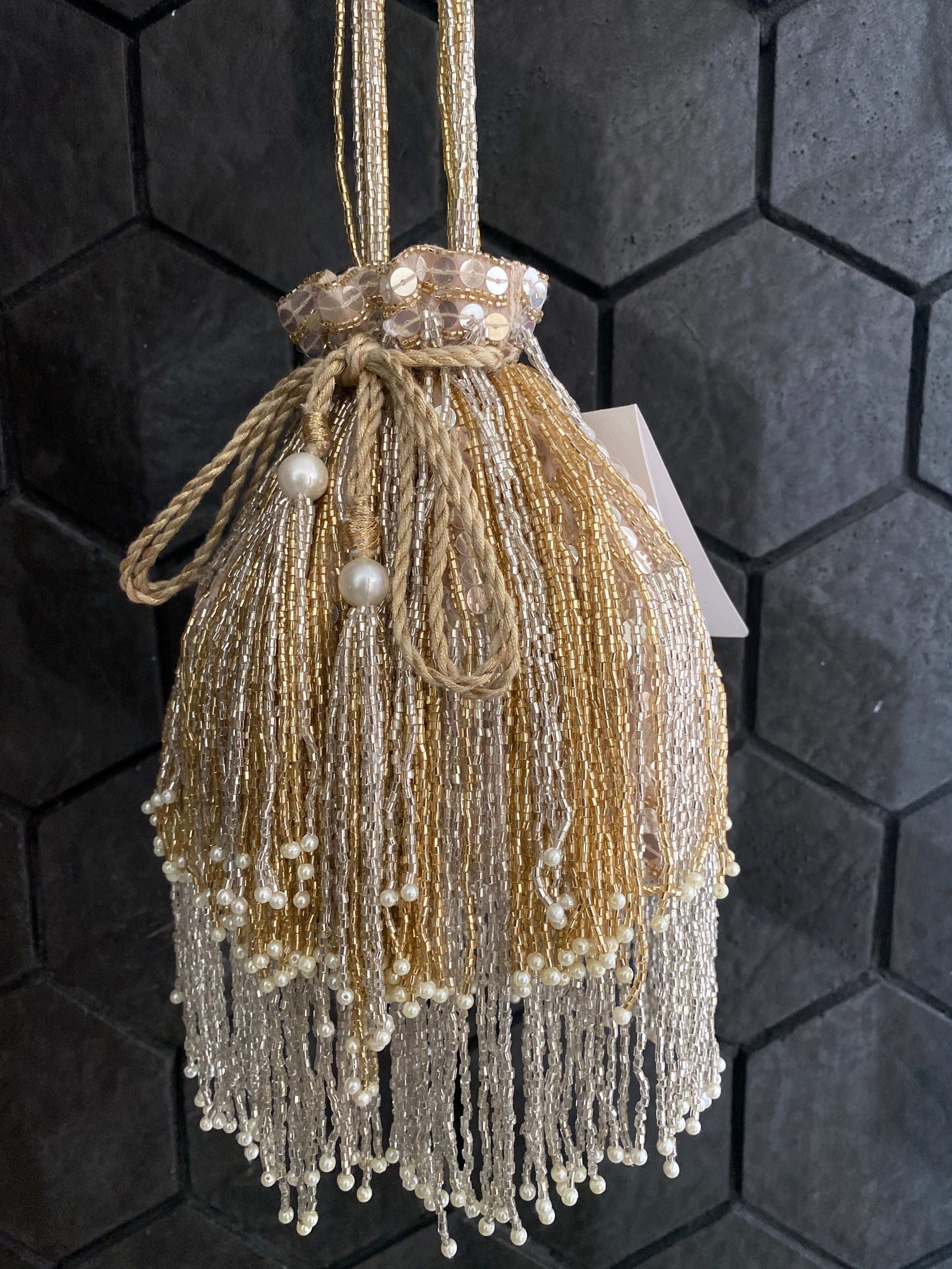 Gold and silver cutdana embellished potli bag