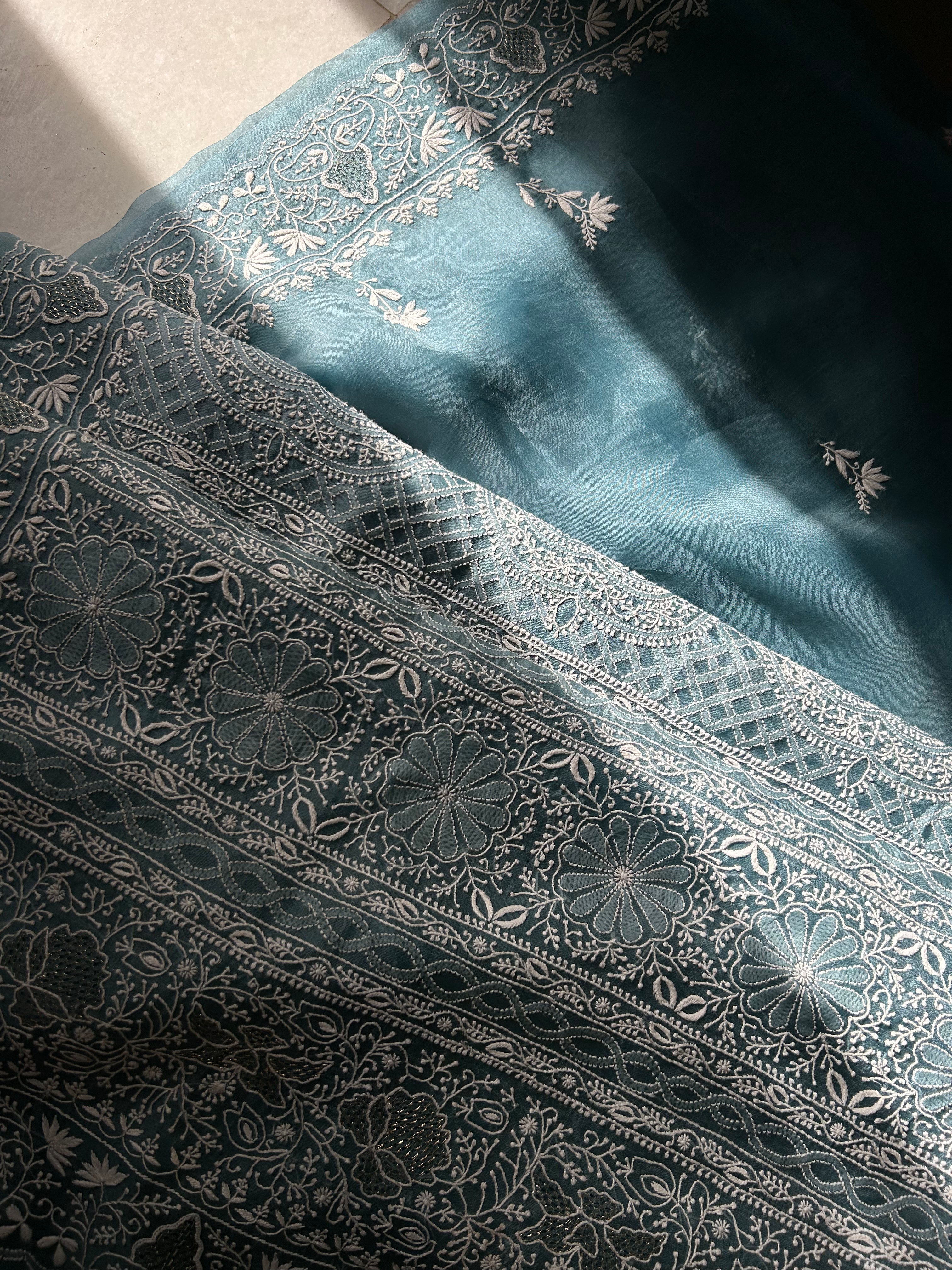 Exclusive Teal Blue Organza Chikankari Saree with statement paan boota