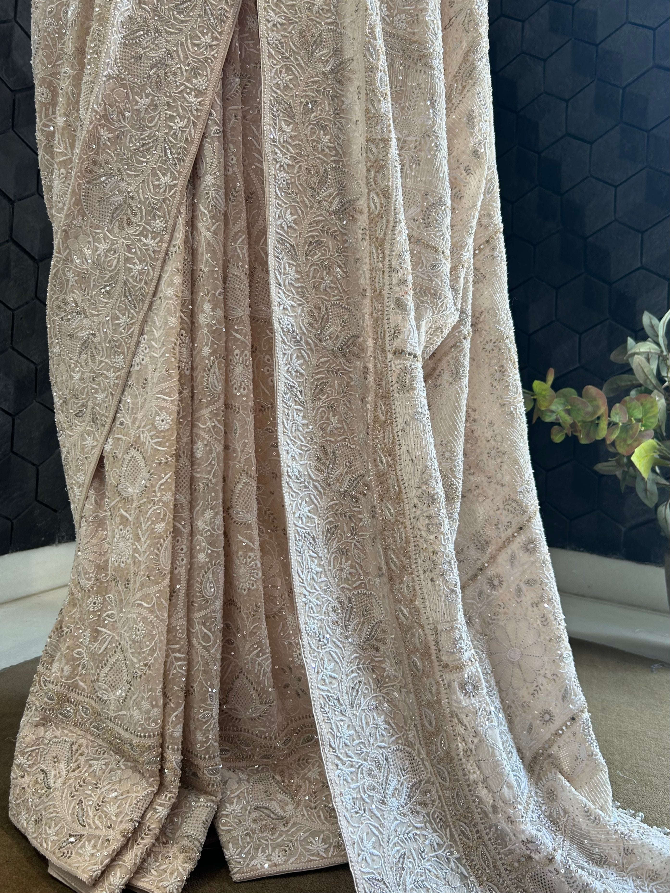 PREMIUM DULL PEACH GEORGETTE CHIKANKARI SAREE WITH STATEMENT FLOWER MOTIFS