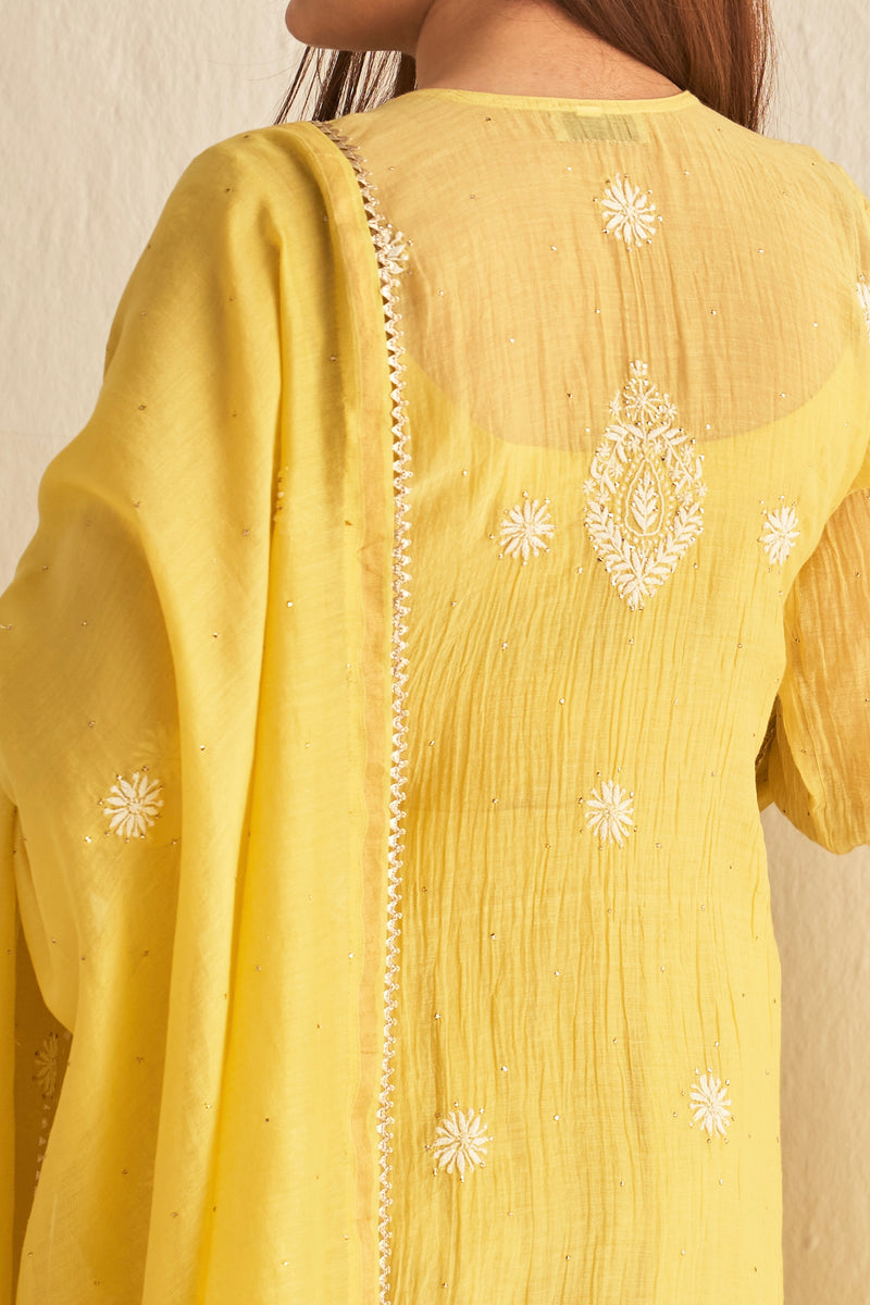 Yellow mul chanderi sharara set with mukaish and chikankari work