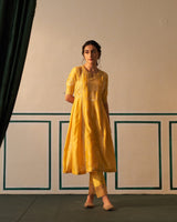 Mustard Chanderi Anarkali with heavy front and back work