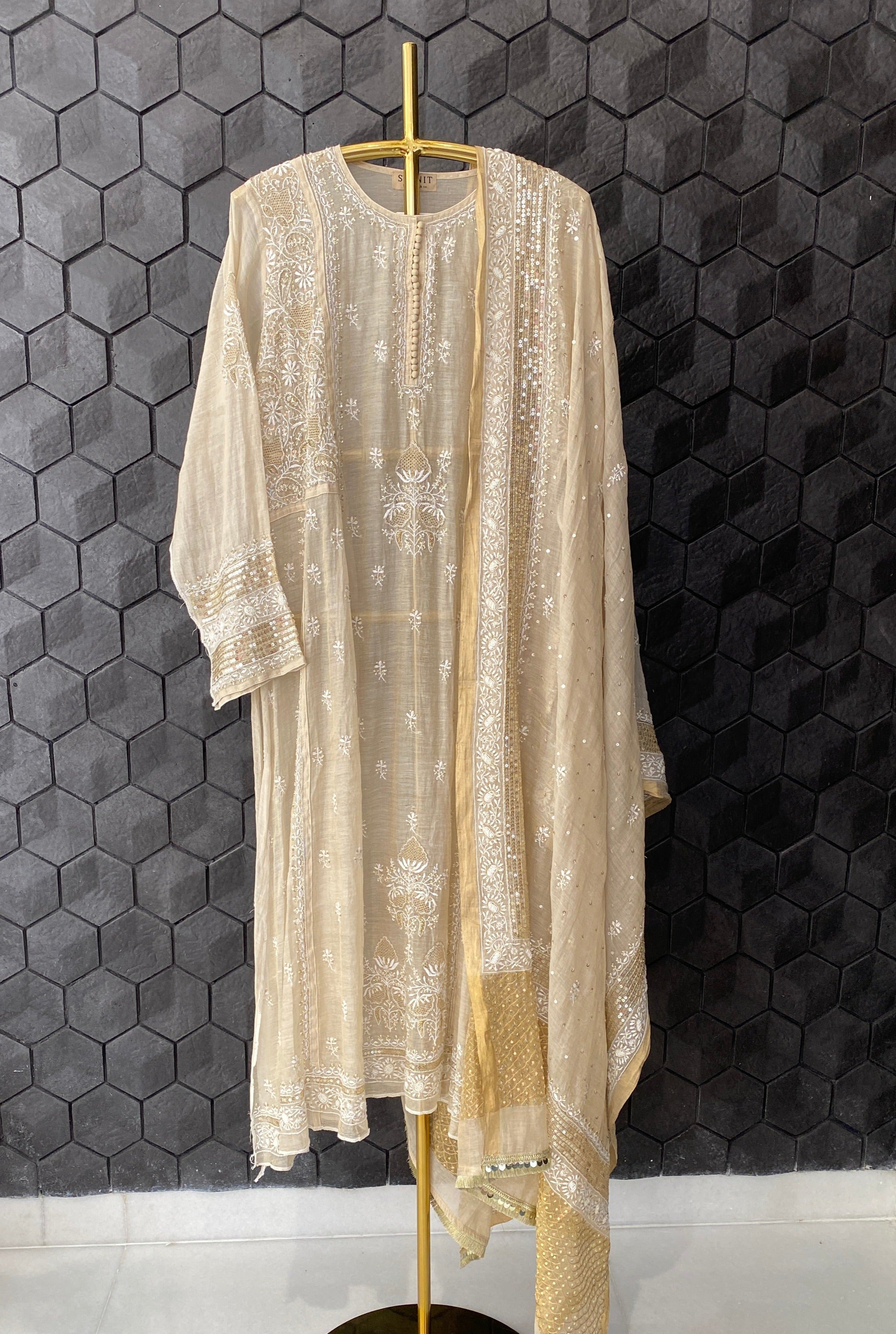 Gold tissue A-line kurta set with heavy sequins dupatta