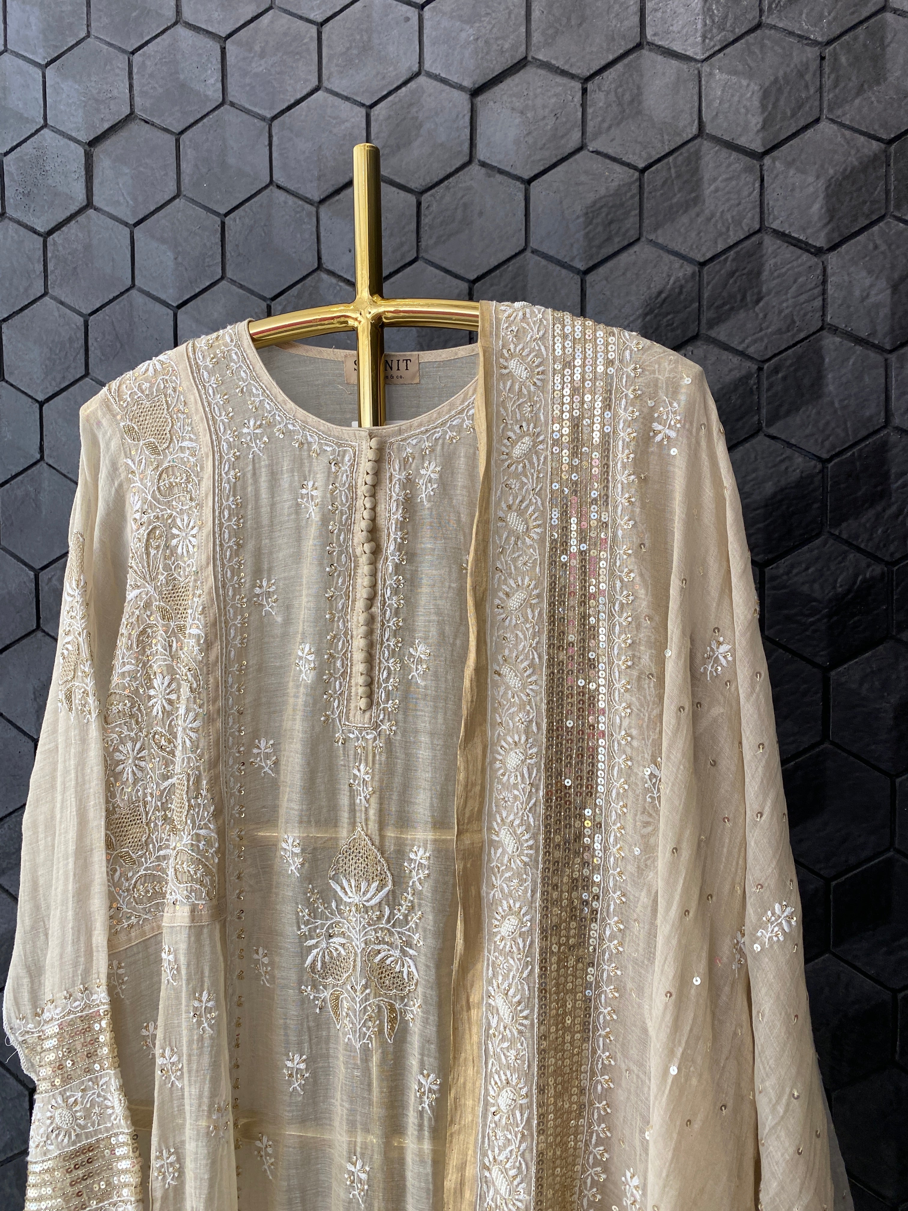 Gold tissue A-line kurta set with heavy sequins dupatta