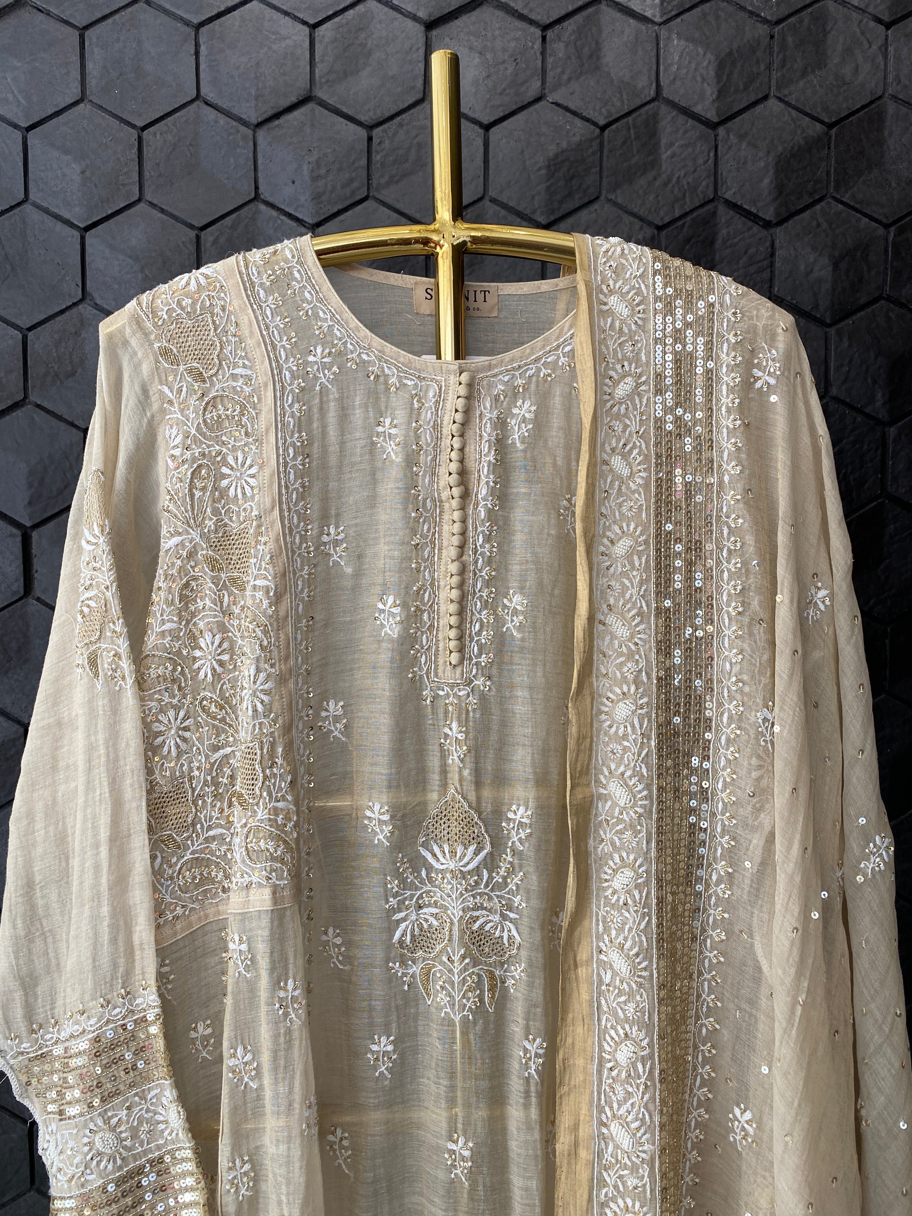 Gold tissue A-line kurta set with heavy sequins dupatta