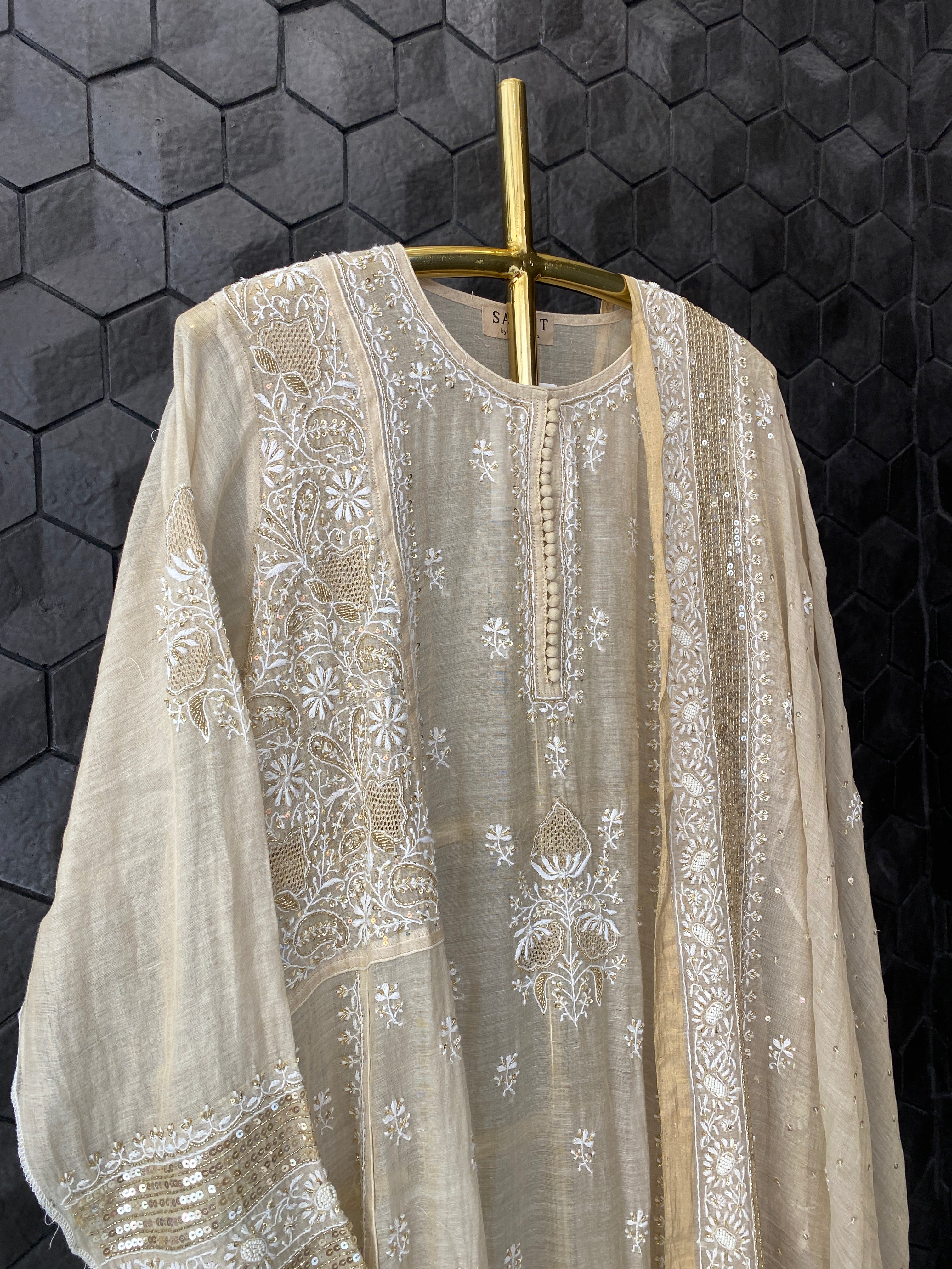 Gold tissue A-line kurta set with heavy sequins dupatta