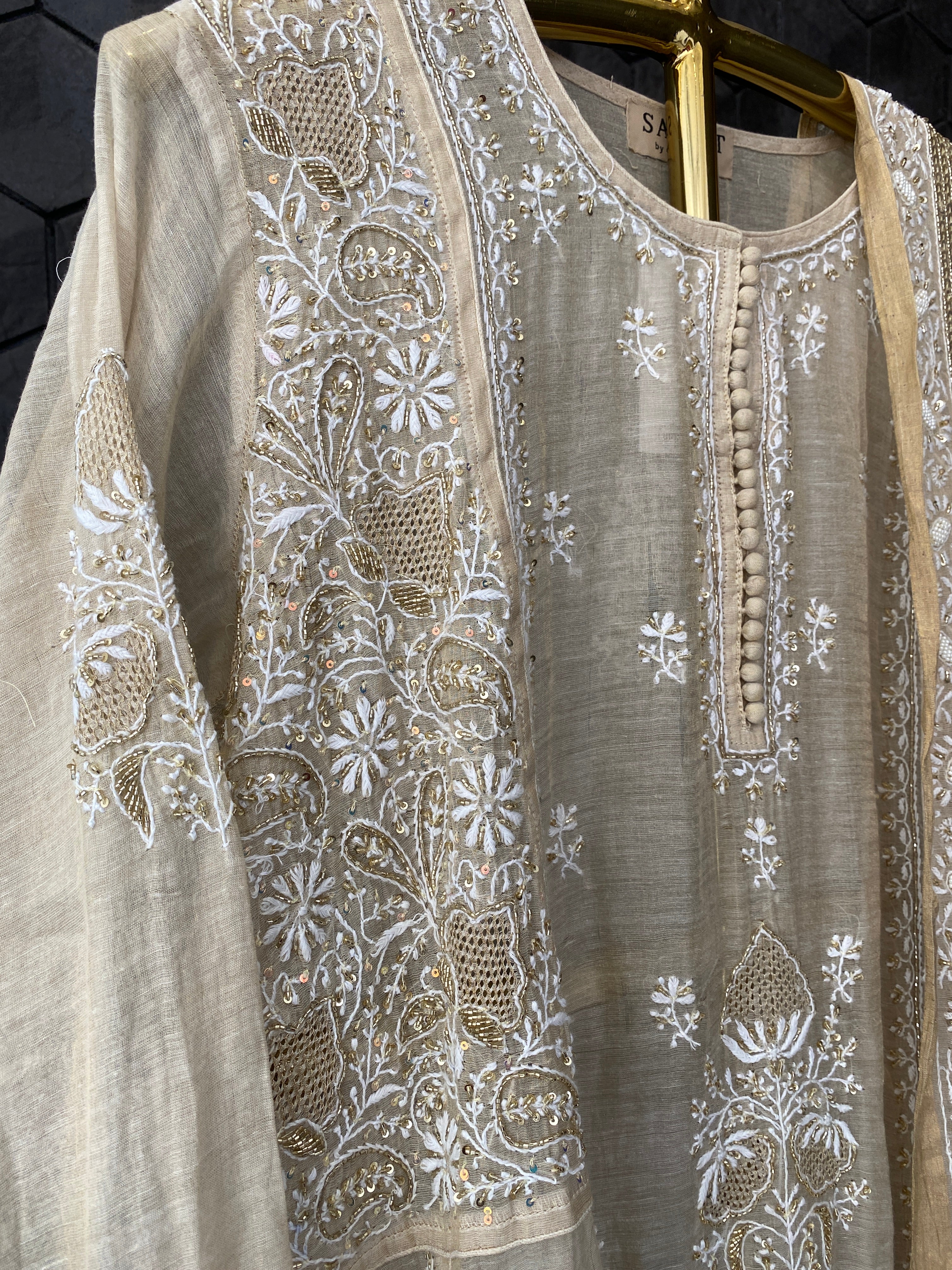 Gold tissue A-line kurta set with heavy sequins dupatta