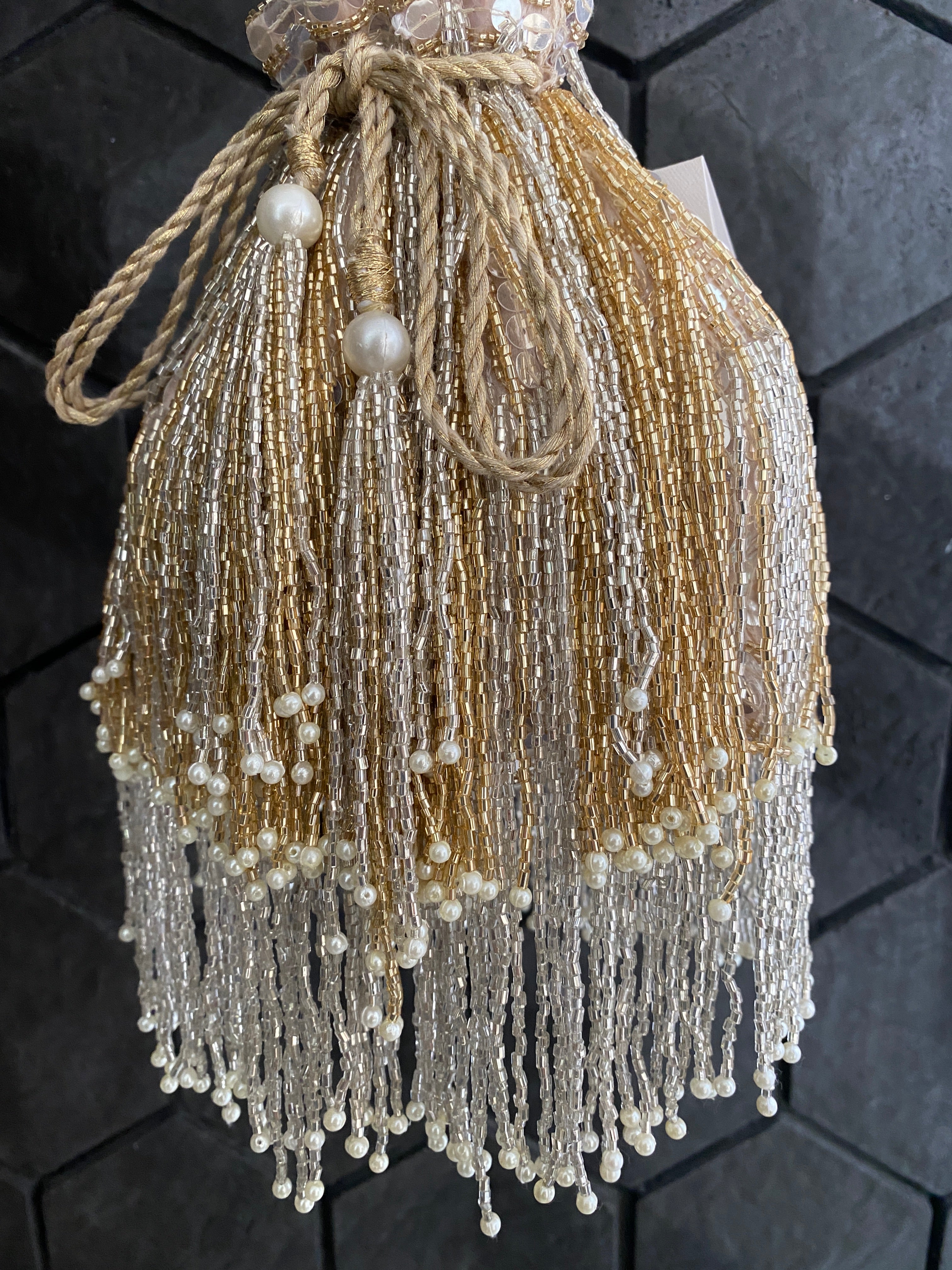 Gold and silver cutdana embellished potli bag