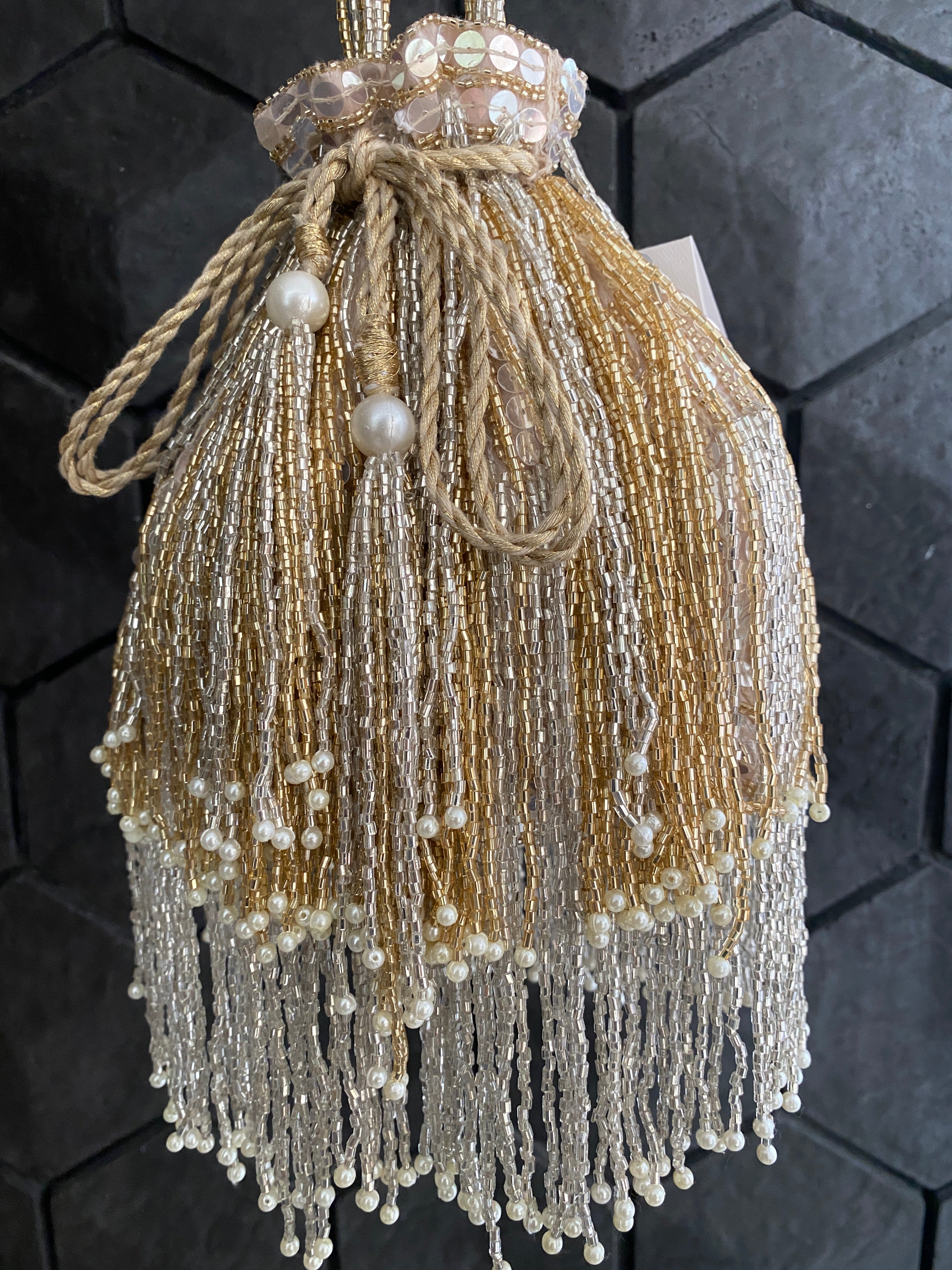 Gold and silver cutdana embellished potli bag